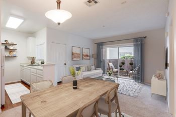 a living room and dining room with a table and a couch